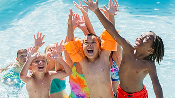 children playing in pool